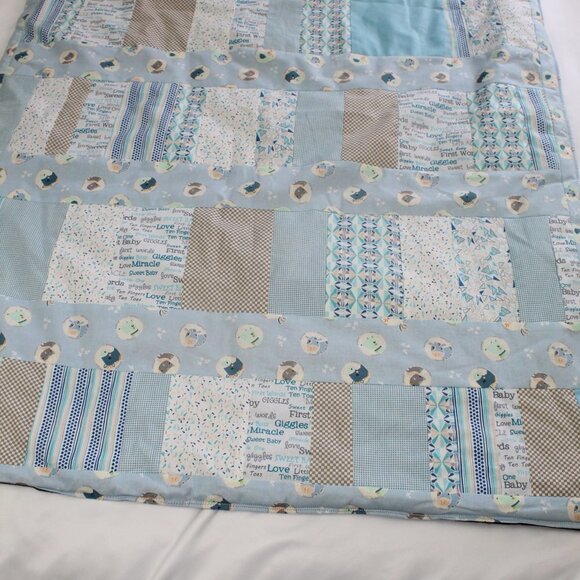 Homemade blue themed quilted baby blanket back is grey fleece. - Picture 2 of 5